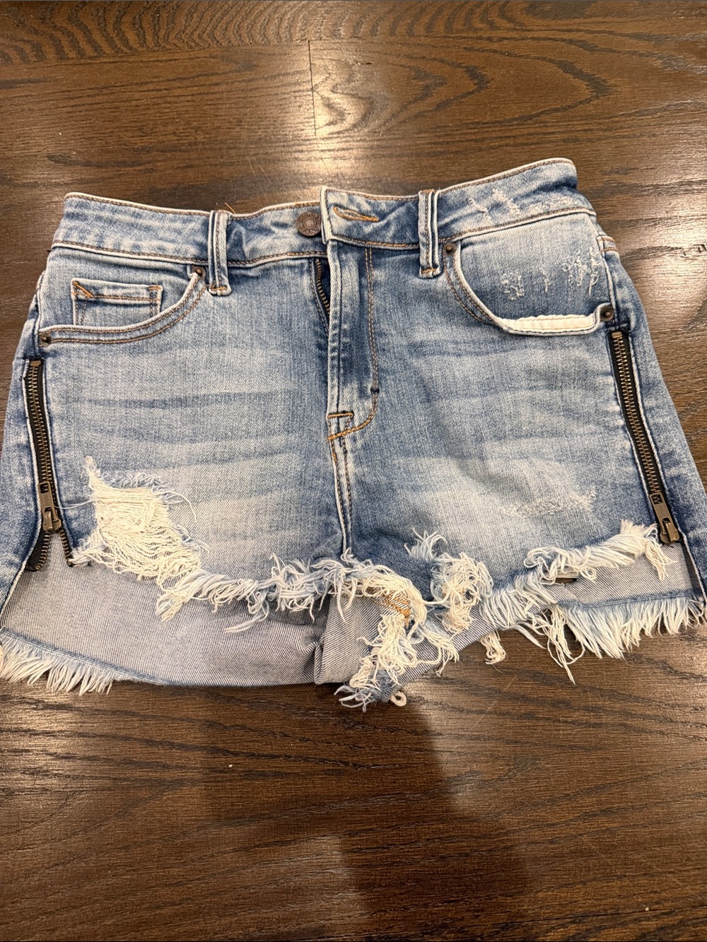 Hidden Jeans Distressed Light Wash Denim Shorts with Zipper Detail